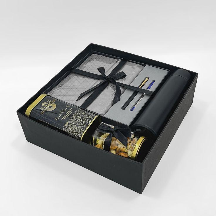 Black corporate gift box with diary, pens, flask and snacks