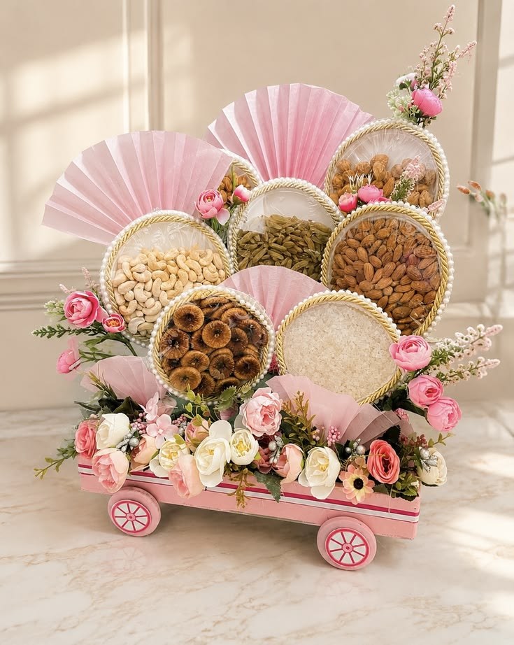 Festive dry-fruit hamper on a pink wooden cart