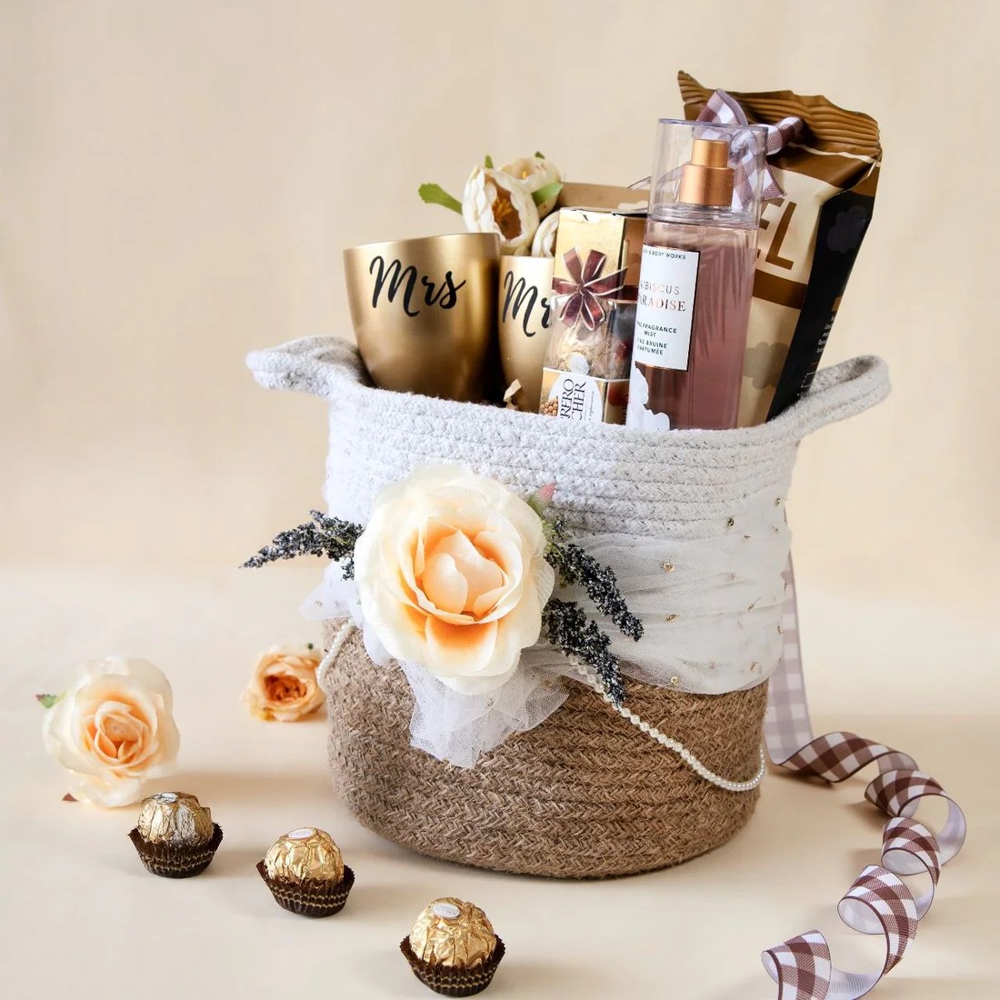 Mr & Mrs wedding gift hamper in a jute basket with roses