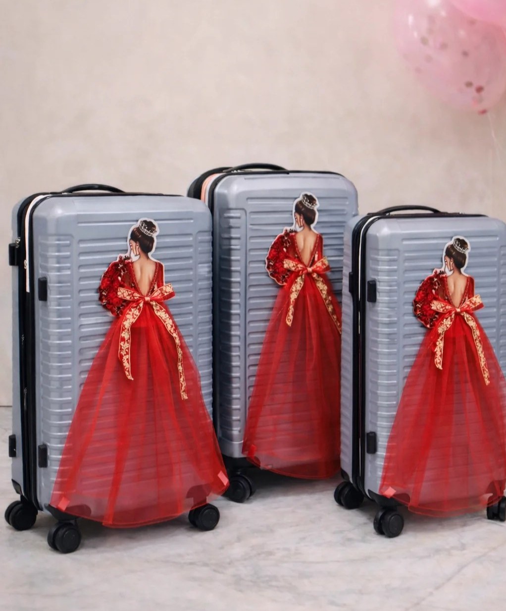 Bridal trolley bags decorated with illustrated bride in red gown