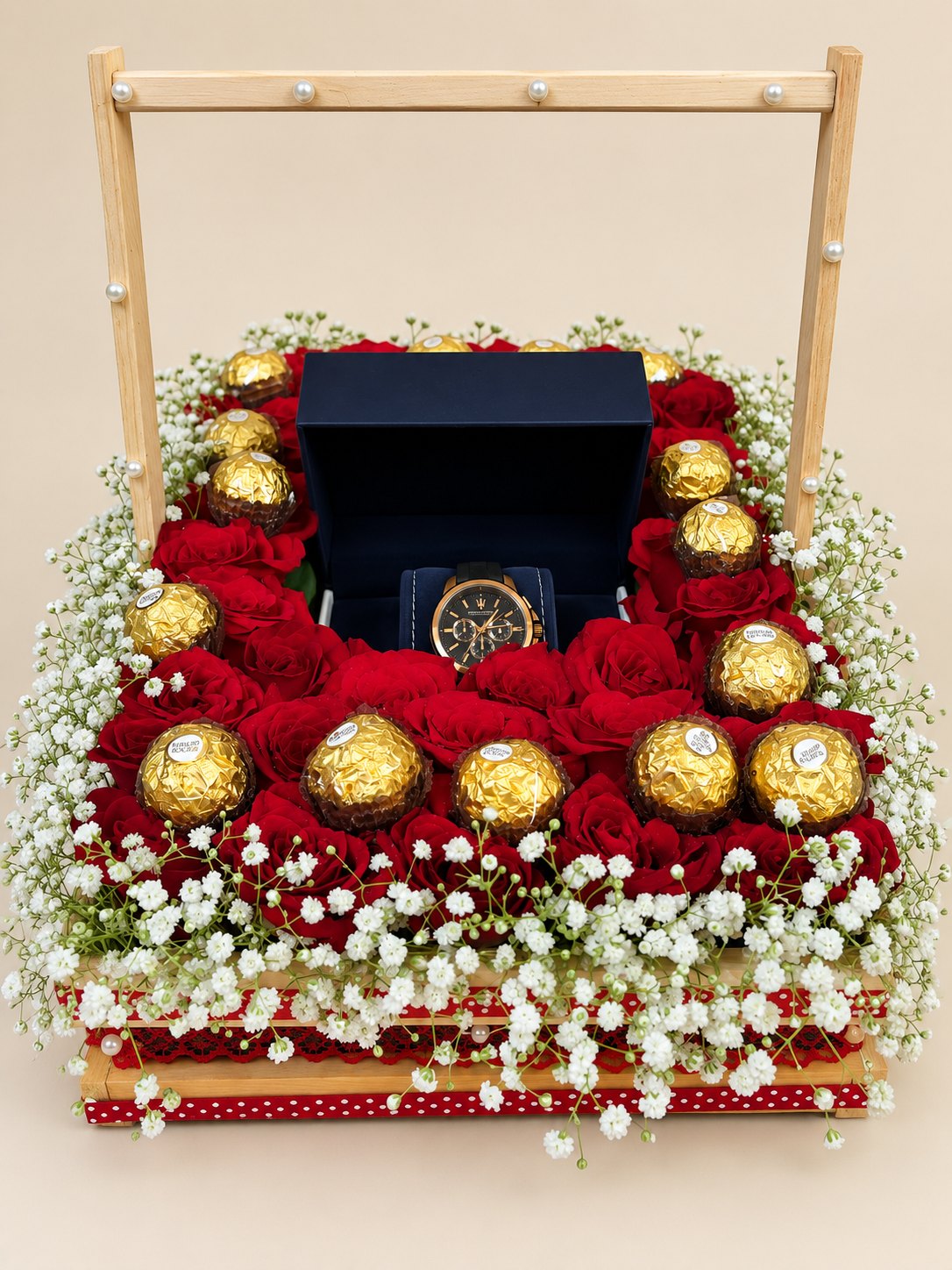 Gift tray of roses, golden chocolates and a wrist watch